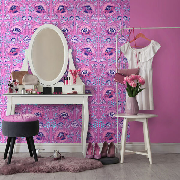 Bright pink wall paint and pink floral wallpaper in a dressing room